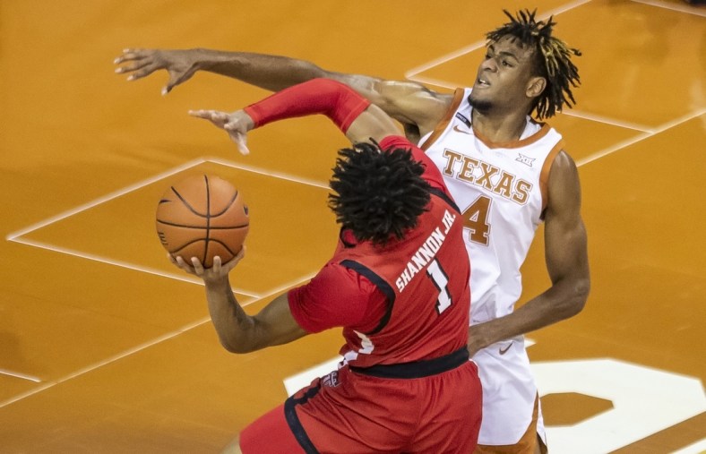 Jan 13, 2021, Austin, Texas, USA; Texas Tech Red Raiders guard Terrence Shannon Jr. (1) drives against Texas Longhorns forward Greg Brown (4) in the first half of an NCAA college basketball game on Wednesday, Jan. 13, 2021, in Austin, Texas.  Mandatory credit: Ricardo B. Brazziell /American-Statesman via USA TODAY Network