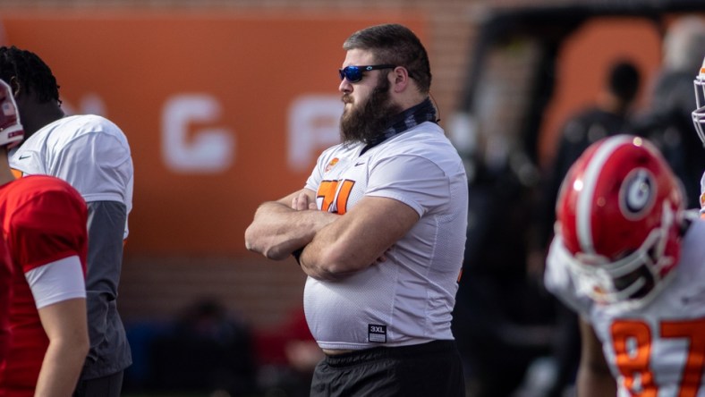 Jan 27, 2021; American offensive lineman Ben Cleveland of Georgia  (74) watches drills during American practice at Hancock Whitney Stadium in Mobile, Alabama, USA;  Mandatory Credit: Vasha Hunt-USA TODAY Sports