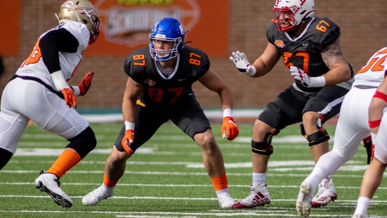 Jan 30, 2021; Mobile, AL, USA; National tight end John Bates of Boise State  (87) and National offensive lineman Brenden Jaimes of Nebraska (67) and American linebacker Janarius Robinson of Florida State (96) in the first half of the 2021 Senior Bowl at Hancock Whitney Stadium. Mandatory Credit: Vasha Hunt-USA TODAY Sports