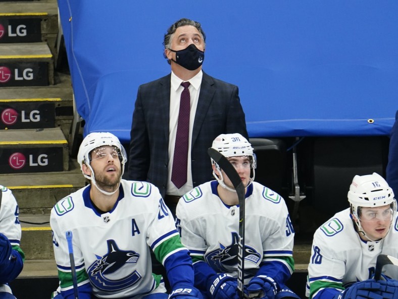 Feb 4, 2021; Toronto, Ontario, CAN; Vancouver Canucks head coach Travis Green looks up at the scoreboard during the third period against the Toronto Maple Leafs at Scotiabank Arena. Toronto defeated Vancouver. Mandatory Credit: John E. Sokolowski-USA TODAY Sports