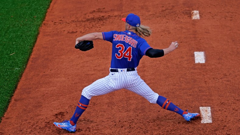 Feb 24, 2021; Port St. Lucie, Florida, USA; New York Mets starting pitcher Noah Syndergaard (34) throws in the bull pen during spring training workouts at Clover Park. Mandatory Credit: Jasen Vinlove-USA TODAY Sports