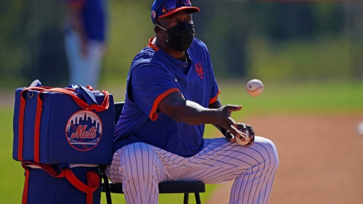 Feb 25, 2021; Port St. Lucie, Florida, USA; New York Mets hitting coach Chili Davis tosses base balls during spring training workouts at Clover Park. Mandatory Credit: Jasen Vinlove-USA TODAY Sports