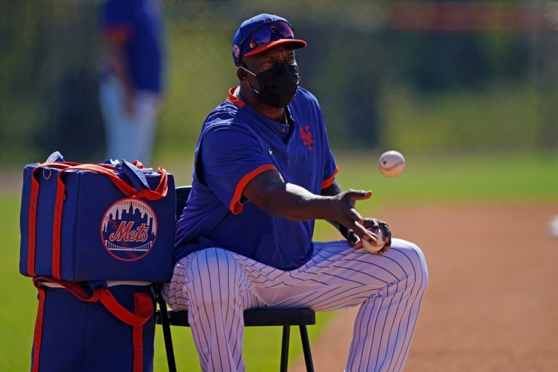 Feb 25, 2021; Port St. Lucie, Florida, USA; New York Mets hitting coach Chili Davis tosses base balls during spring training workouts at Clover Park. Mandatory Credit: Jasen Vinlove-USA TODAY Sports