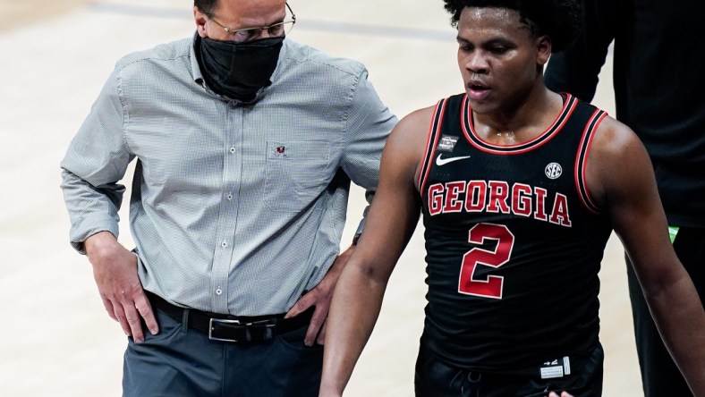 Georgia head coach Tom Crean works with guard Sahvir Wheeler (2) during the first half of the SEC Men's Basketball Tournament game against Missouri at Bridgestone Arena in Nashville, Tenn., Thursday, March 11, 2021.

Mo Ga Sec 031121 An 013