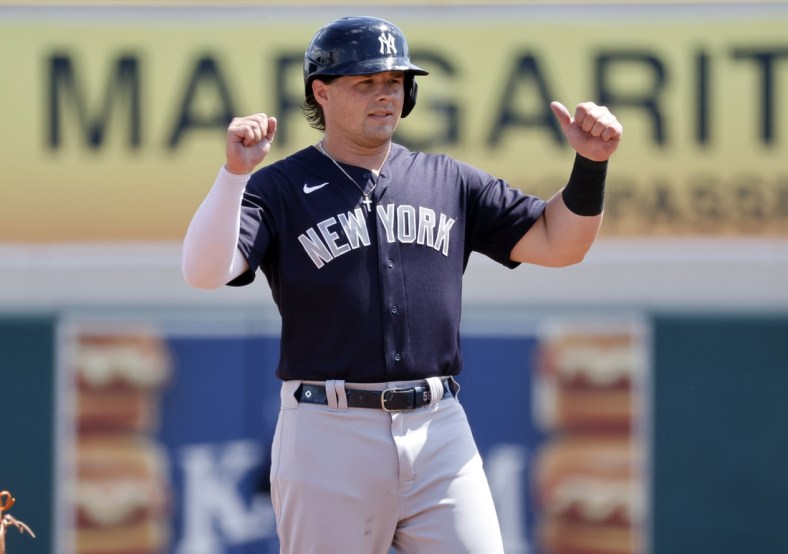 Mar 16, 2021; Lakeland, Florida, USA;  New York Yankees first baseman Luke Voit (59) celebrates as he steals second base on a pass ball during the first inning against the Detroit Tigers at Publix Field at Joker Marchant Stadium. Mandatory Credit: Kim Klement-USA TODAY Sports