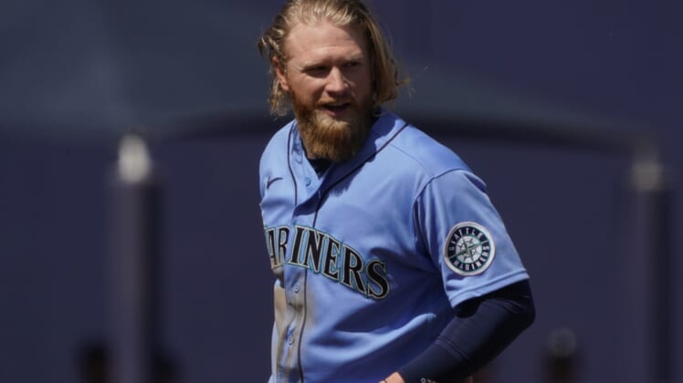 Mar 21, 2021; Phoenix, Arizona, USA; Seattle Mariners center fielder Jake Fraley (28) reacts after hitting a double against the Milwaukee Brewers during a spring training game at American Family Fields of Phoenix. Mandatory Credit: Rick Scuteri-USA TODAY Sports