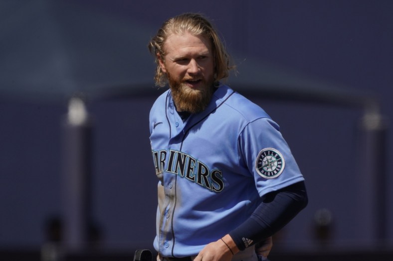 Mar 21, 2021; Phoenix, Arizona, USA; Seattle Mariners center fielder Jake Fraley (28) reacts after hitting a double against the Milwaukee Brewers during a spring training game at American Family Fields of Phoenix. Mandatory Credit: Rick Scuteri-USA TODAY Sports