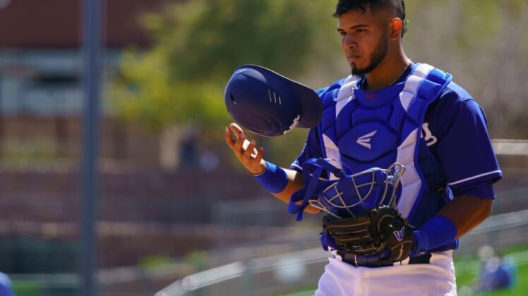 Mar 21, 2021; Phoenix, Arizona, USA; Los Angeles Dodgers catcher Keibert Ruiz (25) tosses his helmet in the third inning against the San Francisco Giants during a Spring Training game at Camelback Ranch, Glendale. Mandatory Credit: Allan Henry-USA TODAY Sports