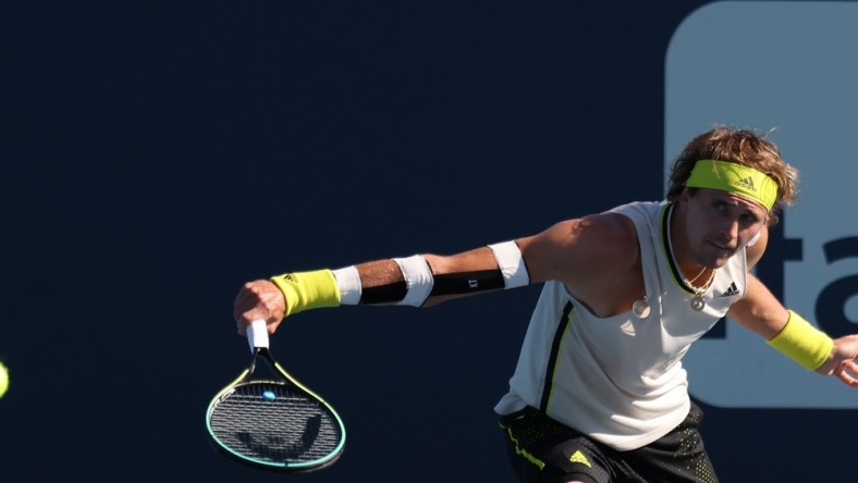 Mar 26, 2021; Miami, Florida, USA; Alexander Zverev of Germany hits a backhand against Emil Ruusuvuori of Finland (not pictured) in the second round in the Miami Open at Hard Rock Stadium. Mandatory Credit: Geoff Burke-USA TODAY Sports