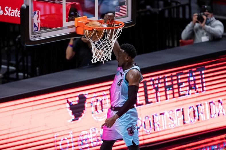 Apr 1, 2021; Miami, Florida, USA; Miami Heat guard Victor Oladipo (4) dunks on a fast break during the first quarter of a game against the Golden State Warriors at American Airlines Arena. Mandatory Credit: Mary Holt-USA TODAY Sports