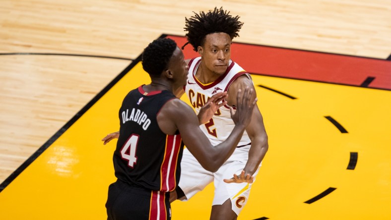 Apr 3, 2021; Miami, Florida, USA; Cleveland Cavaliers guard Collin Sexton (2) plays defense against Miami Heat guard Victor Oladipo (4) during the first of a game at American Airlines Arena. Mandatory Credit: Mary Holt-USA TODAY Sports