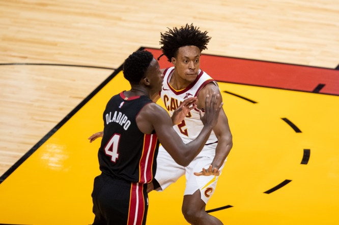 Apr 3, 2021; Miami, Florida, USA; Cleveland Cavaliers guard Collin Sexton (2) plays defense against Miami Heat guard Victor Oladipo (4) during the first of a game at American Airlines Arena. Mandatory Credit: Mary Holt-USA TODAY Sports