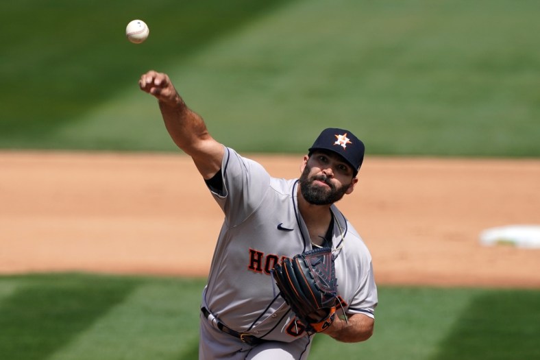 Apr 4, 2021; Oakland, California, USA; Houston Astros starting pitcher Jose Urquidy (65) throws a pitch during the fourth inning against the Oakland Athletics at RingCentral Coliseum. Mandatory Credit: Darren Yamashita-USA TODAY Sports