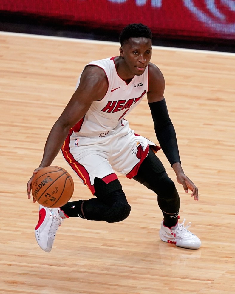 Apr 6, 2021; Miami, Florida, USA; Miami Heat guard Victor Oladipo (4) dribbles the ball up the court against the Memphis Grizzlies during the first half at American Airlines Arena. Mandatory Credit: Jasen Vinlove-USA TODAY Sports