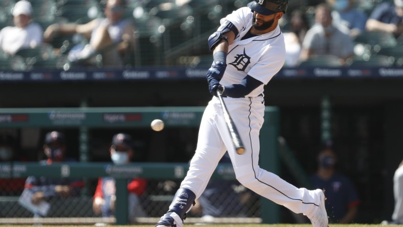 Apr 7, 2021; Detroit, Michigan, USA; Detroit Tigers designated hitter Nomar Mazara (15) hits a single during the sixth inning against the Minnesota Twins at Comerica Park. Mandatory Credit: Raj Mehta-USA TODAY Sports