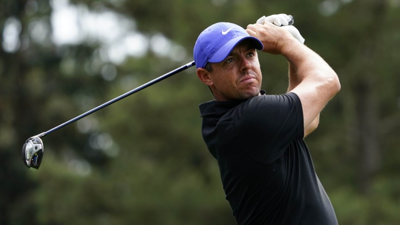 Apr 8, 2021; Augusta, Georgia, USA; Rory McIlroy hits his tee shot on the 18th hole during the first round of The Masters golf tournament. Mandatory Credit: Michael Madrid-USA TODAY Sports