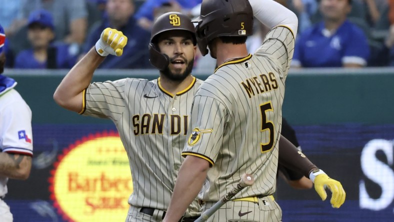 Apr 10, 2021; Arlington, Texas, USA;  San Diego Padres first baseman Eric Hosmer (30) celebrates with designated hitter Wil Myers (5) after hitting a home run during the fourth inning against the Texas Rangers at Globe Life Field. Mandatory Credit: Kevin Jairaj-USA TODAY Sports