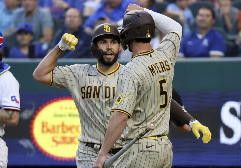 Apr 10, 2021; Arlington, Texas, USA;  San Diego Padres first baseman Eric Hosmer (30) celebrates with designated hitter Wil Myers (5) after hitting a home run during the fourth inning against the Texas Rangers at Globe Life Field. Mandatory Credit: Kevin Jairaj-USA TODAY Sports