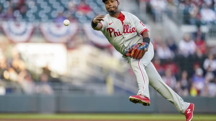 Apr 11, 2021; Cumberland, Georgia, USA; Philadelphia Phillies shortstop Jean Segura (2) throws to first base late on a single by Atlanta Braves third baseman Austin Riley (not pictured) during the first inning at Truist Park. Mandatory Credit: Dale Zanine-USA TODAY Sports