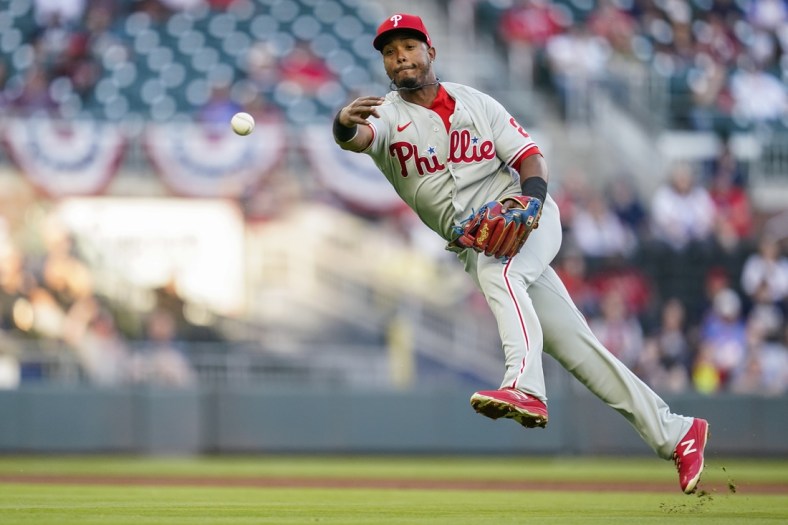 Apr 11, 2021; Cumberland, Georgia, USA; Philadelphia Phillies shortstop Jean Segura (2) throws to first base late on a single by Atlanta Braves third baseman Austin Riley (not pictured) during the first inning at Truist Park. Mandatory Credit: Dale Zanine-USA TODAY Sports