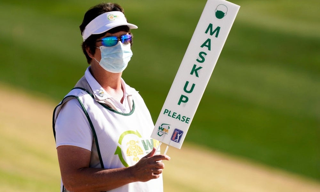 Spectators are reminded to wear their masks at the 12th hole during round three of the Waste Management Phoenix Open at TPC Scottsdale. (Photo: Rob Schumacher-Arizona Republic)Pga Wm Phoenix Open Round Three