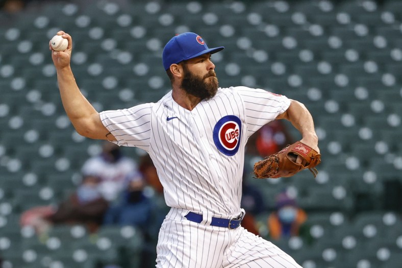 Apr 20, 2021; Chicago, Illinois, USA; Chicago Cubs starting pitcher Jake Arrieta (49) delivers against the New York Mets during the first inning at Wrigley Field. Mandatory Credit: Kamil Krzaczynski-USA TODAY Sports