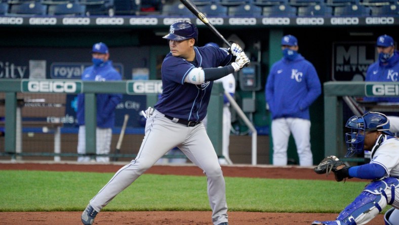 Apr 20, 2021; Kansas City, Missouri, USA; Tampa Bay Rays first baseman Yoshi Tsutsugo (25) at bat in the first inning against the Kansas City Royals at Kauffman Stadium. Mandatory Credit: Denny Medley-USA TODAY Sports