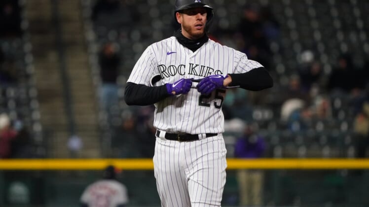 Apr 20, 2021; Denver, Colorado, USA; Colorado Rockies first baseman C.J. Cron (25) following a two run double in the sixth inning against the Houston Astros at Coors Field. Mandatory Credit: Ron Chenoy-USA TODAY Sports