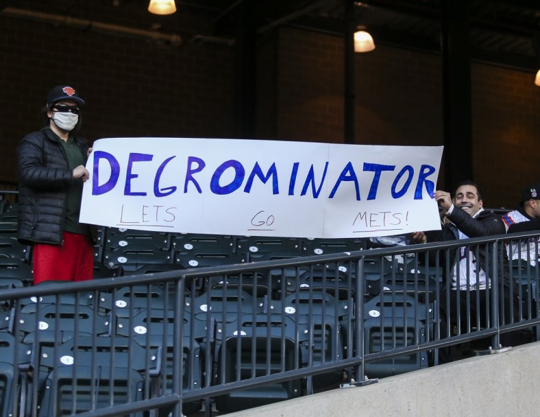 Apr 23, 2021; New York City, New York, USA; Fans hold up a sign for New York Mets pitcher Jacob deGrom prior to the game against the Washington Nationals at Citi Field. Mandatory Credit: Wendell Cruz-USA TODAY Sports