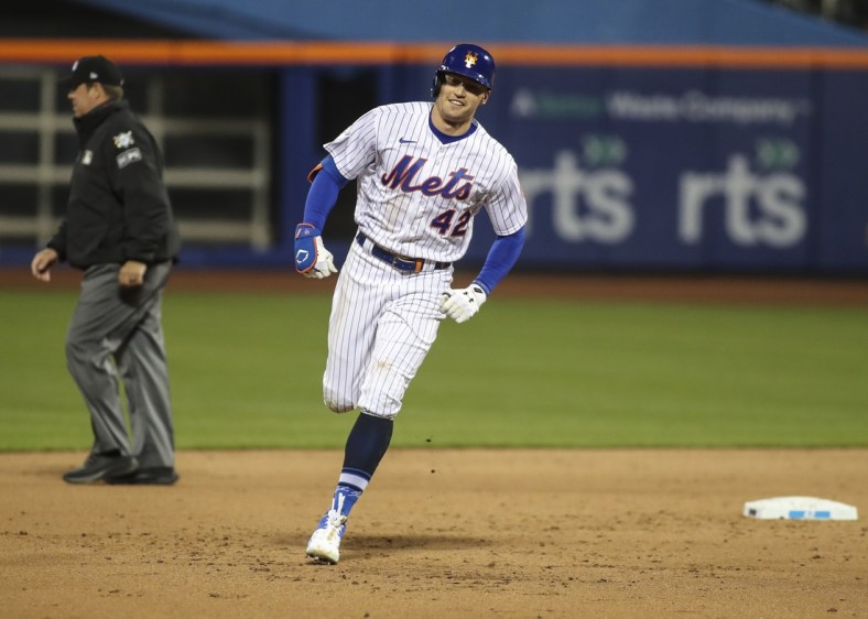 Apr 23, 2021; New York City, New York, USA; New York Mets center fielder Brandon Nimmo rounds second base in the eighth inning after hitting a home run against the Washington Nationals at Citi Field. Mandatory Credit: Wendell Cruz-USA TODAY Sports