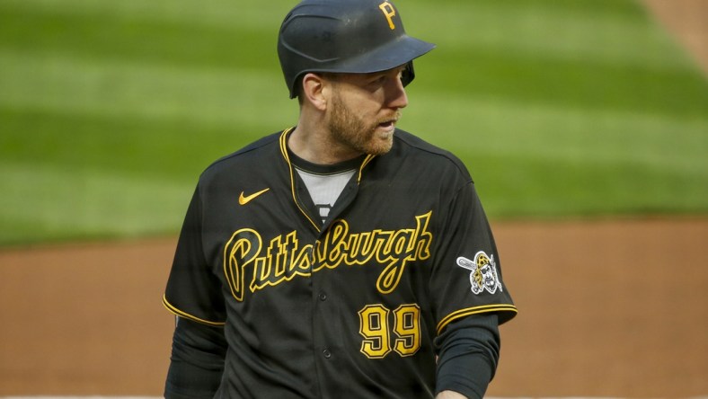 Apr 23, 2021; Minneapolis, Minnesota, USA; Pittsburgh Pirates first baseman Todd Frazier (99) returns to the dugout after striking out to the Minnesota Twins in the second inning at Target Field. Mandatory Credit: Bruce Kluckhohn-USA TODAY Sports