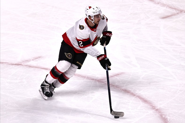 Apr 17, 2021; Montreal, Quebec, CAN; Ottawa Senators defenseman Artem Zub (2) skates with the puck against Montreal Canadiens during the first period at Bell Centre. Mandatory Credit: Jean-Yves Ahern-USA TODAY Sports