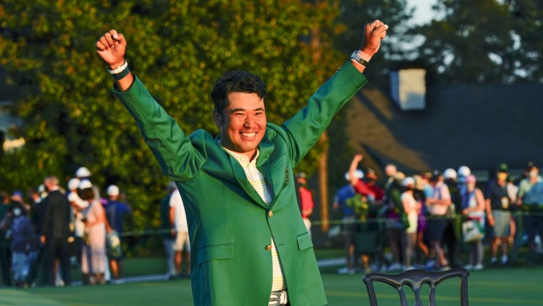 Apr 11, 2021; Augusta, Georgia, USA; Hideki Matsuyama celebrates his victory following the final round of The Masters golf tournament in his green jacket. Mandatory Credit: Michael Madrid-USA TODAY Sports