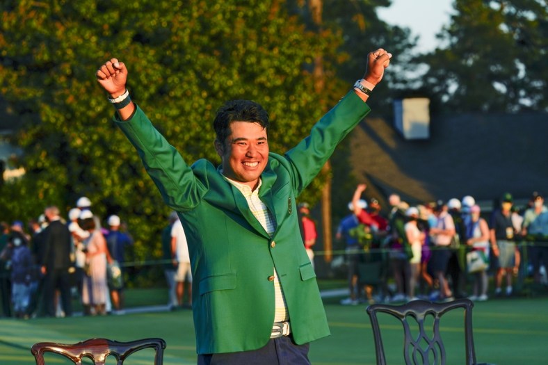 Apr 11, 2021; Augusta, Georgia, USA; Hideki Matsuyama celebrates his victory following the final round of The Masters golf tournament in his green jacket. Mandatory Credit: Michael Madrid-USA TODAY Sports