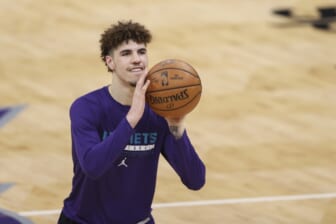 Apr 27, 2021; Charlotte, North Carolina, USA; Charlotte Hornets guard LaMelo Ball (2), who is not playing due to a fractured wrist, shoots before the Charlotte Hornets play against the Milwaukee Bucks at Spectrum Center. Mandatory Credit: Nell Redmond-USA TODAY Sports