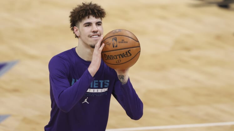 Apr 27, 2021; Charlotte, North Carolina, USA; Charlotte Hornets guard LaMelo Ball (2), who is not playing due to a fractured wrist, shoots before the Charlotte Hornets play against the Milwaukee Bucks at Spectrum Center. Mandatory Credit: Nell Redmond-USA TODAY Sports