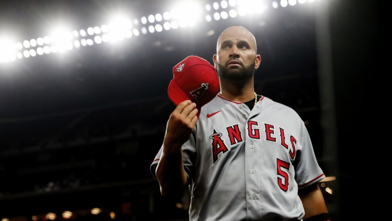 Apr 27, 2021; Arlington, Texas, USA;  Los Angeles Angels first baseman Albert Pujols (5) reacts during the game against the Texas Rangers at Globe Life Field. Mandatory Credit: Kevin Jairaj-USA TODAY Sports