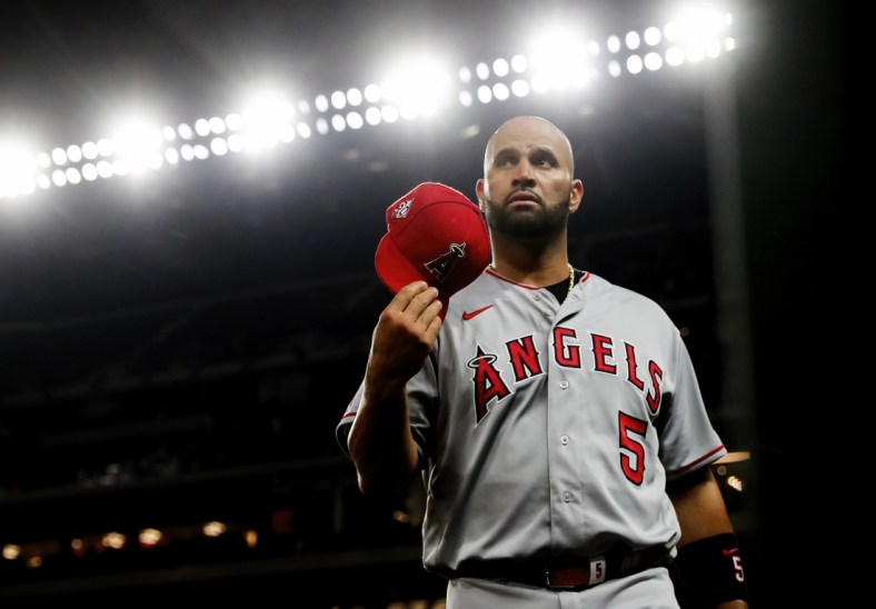 Apr 27, 2021; Arlington, Texas, USA;  Los Angeles Angels first baseman Albert Pujols (5) reacts during the game against the Texas Rangers at Globe Life Field. Mandatory Credit: Kevin Jairaj-USA TODAY Sports