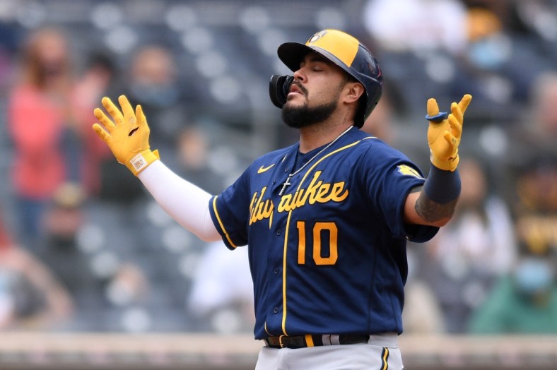 Apr 21, 2021; San Diego, California, USA; Milwaukee Brewers catcher Omar Narvaez (10) celebrates as he approaches home plate after hitting a two-run home run against the San Diego Padres during the sixth inning at Petco Park. Mandatory Credit: Orlando Ramirez-USA TODAY Sports