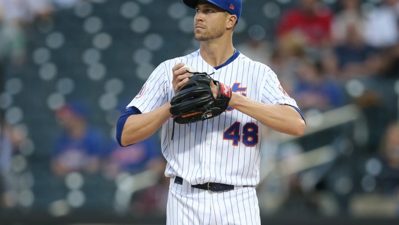 Apr 28, 2021; New York City, New York, USA; New York Mets starting pitcher Jacob deGrom (48) reacts after allowing a run to the Boston Red Sox during the second inning at Citi Field. Mandatory Credit: Brad Penner-USA TODAY Sports