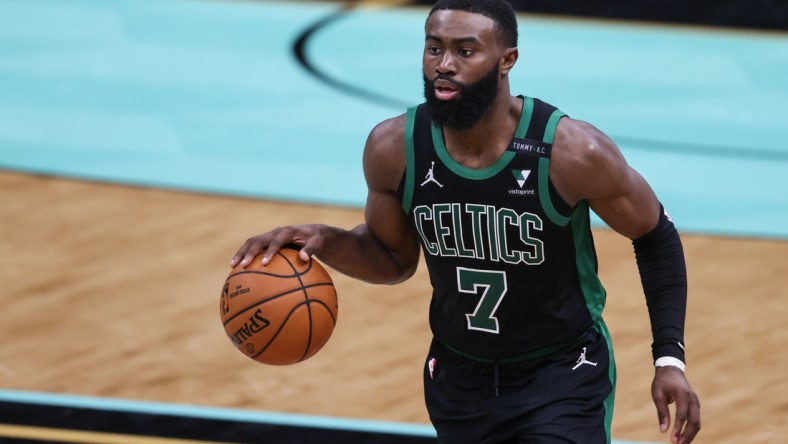 Apr 25, 2021; Charlotte, North Carolina, USA; Boston Celtics guard Jaylen Brown (7) brings the ball up court against the Charlotte Hornets in the second half at Spectrum Center. The Charlotte Hornets won 125-104. Mandatory Credit: Nell Redmond-USA TODAY Sports