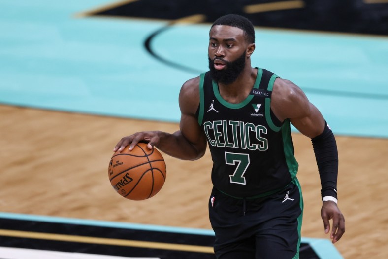 Apr 25, 2021; Charlotte, North Carolina, USA; Boston Celtics guard Jaylen Brown (7) brings the ball up court against the Charlotte Hornets in the second half at Spectrum Center. The Charlotte Hornets won 125-104. Mandatory Credit: Nell Redmond-USA TODAY Sports