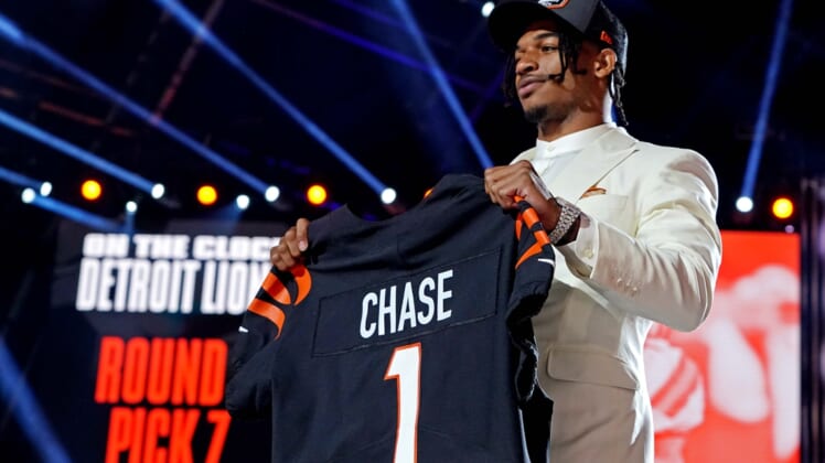 Apr 29, 2021; Cleveland, Ohio, USA; Ja'Marr Chase (LSU) poses with a jersey after being selected by Cincinnati Bengals as the number five overall pick in the first round of the 2021 NFL Draft at First Energy Stadium. Mandatory Credit: Kirby Lee-USA TODAY Sports
