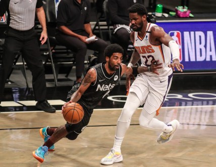 Apr 25, 2021; Brooklyn, New York, USA;  Brooklyn Nets guard Kyrie Irving (11) and Phoenix Suns center Deandre Ayton (22) at Barclays Center. Mandatory Credit: Wendell Cruz-USA TODAY Sports