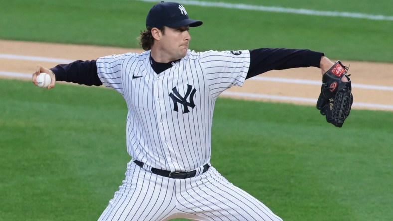 Apr 30, 2021; Bronx, New York, USA; New York Yankees starting pitcher Gerrit Cole (45) delivers a pitch during the first inning against the Detroit Tigers at Yankee Stadium. Mandatory Credit: Vincent Carchietta-USA TODAY Sports