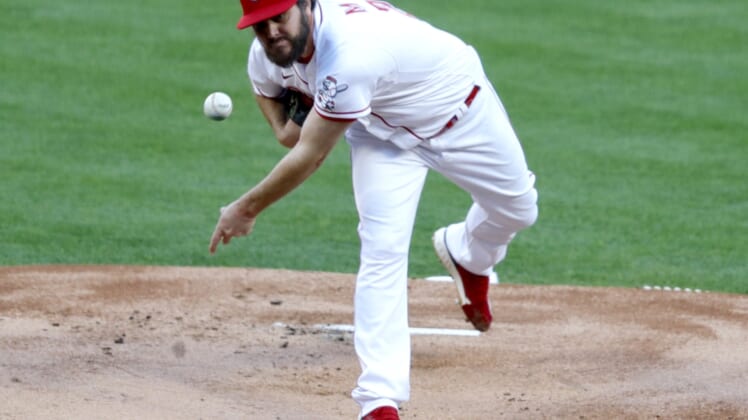 Apr 30, 2021; Cincinnati, Ohio, USA; Cincinnati Reds starting pitcher Wade Miley (22) throws against the Chicago Cubs during the first inning at Great American Ball Park. Mandatory Credit: David Kohl-USA TODAY Sports