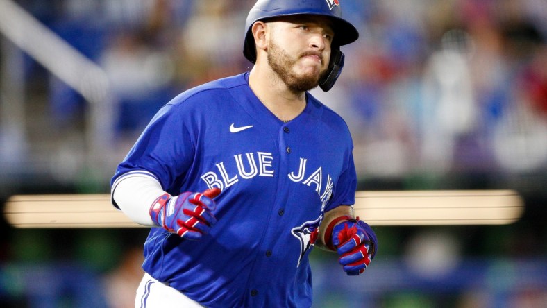 Apr 30, 2021; Dunedin, Florida, CAN;  Toronto Blue Jays catcher Alejandro Kirk (30) rounds first after hitting a two-run home run in the fourth inning against the Atlanta Braves at TD Ballpark. Mandatory Credit: Nathan Ray Seebeck-USA TODAY Sports