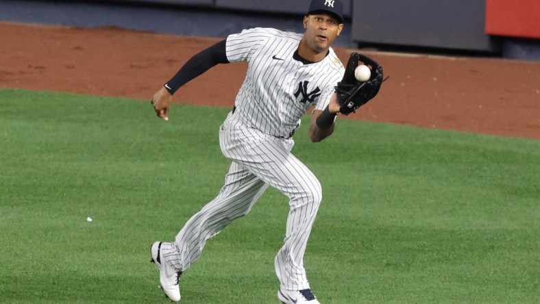 Apr 30, 2021; Bronx, New York, USA; New York Yankees center fielder Aaron Hicks (31) catches the ball for an out during the eighth inning against the Detroit Tigers at Yankee Stadium. Mandatory Credit: Vincent Carchietta-USA TODAY Sports