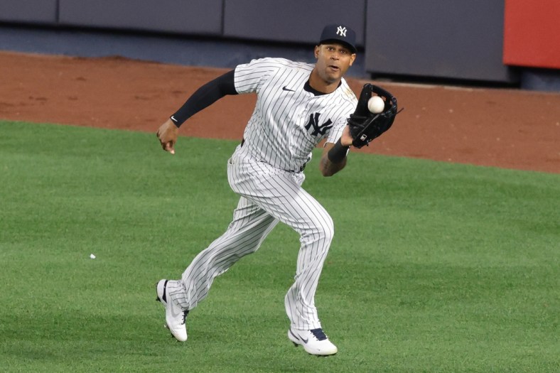 Apr 30, 2021; Bronx, New York, USA; New York Yankees center fielder Aaron Hicks (31) catches the ball for an out during the eighth inning against the Detroit Tigers at Yankee Stadium. Mandatory Credit: Vincent Carchietta-USA TODAY Sports