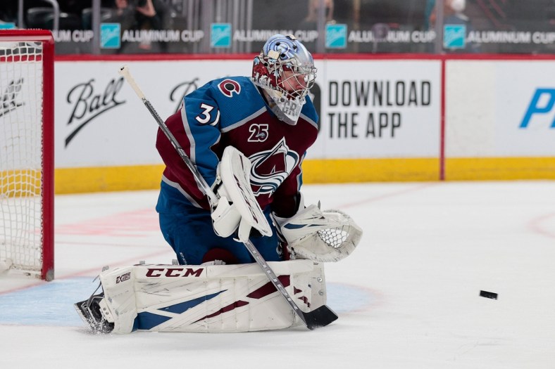 Apr 30, 2021; Denver, Colorado, USA; Colorado Avalanche goaltender Philipp Grubauer (31) makes a save in the second period against the San Jose Sharks at Ball Arena. Mandatory Credit: Isaiah J. Downing-USA TODAY Sports